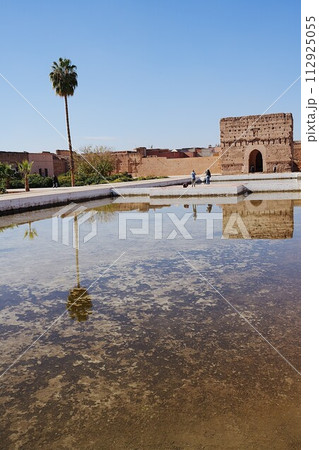 Western pavilion of El Badi palace reflected in water in Marrakech city in Morocco - vertical Western pavilion of El Badi palace reflected in water in Marrakech city in Morocco - vertical 112925055