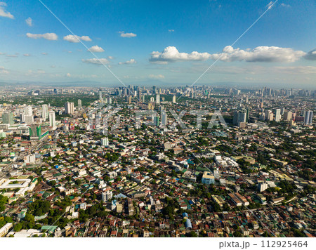 Top view of Manila city, the largest metropolis of Asia with skyscrapers and modern buildings. Philippines. 112925464