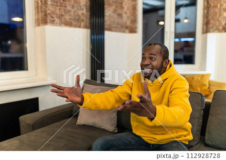 African american young man looking emotional and excited African american young man looking emotional and excited 112928728