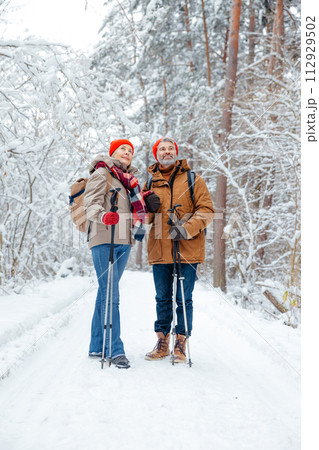 Man and woman feeling excited and contented on a winter walk Man and woman feeling excited and contented on a winter walk 112929502