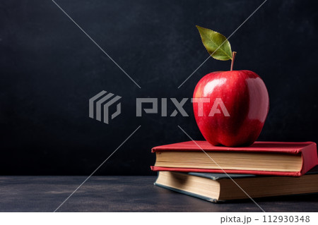 Shiny red apple on vintage books, concept ofの写真素材
