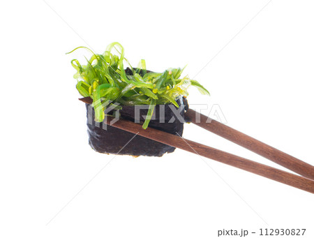 Sushi Sushi in chopsticks 112930827