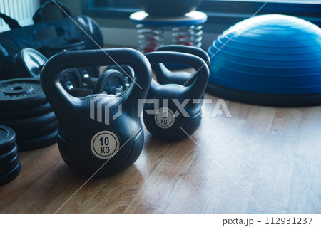 Gym Equipment or Dumbbell Kettlebell in a gym bench  112931237
