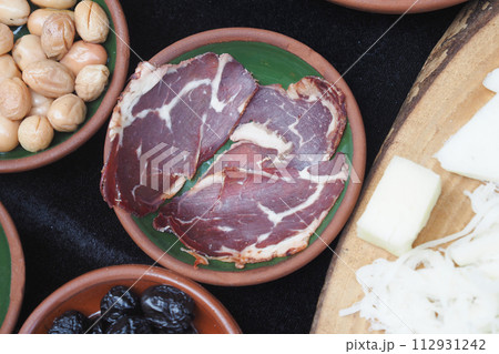 turkish meat pasturma in a bowl served with cheese on table  112931242