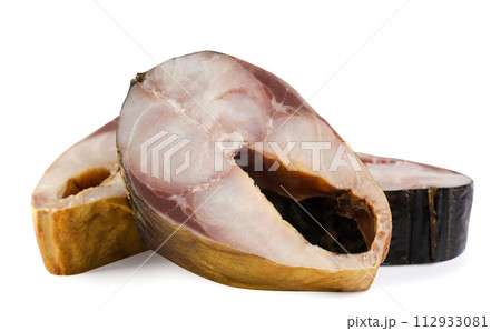 Pieces of smoked fish close-up on a white background. 112933081