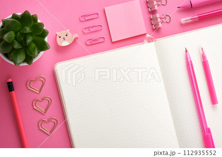 Stationery background with empty notebook page and pink school and office stationery. Flatly. 112935552