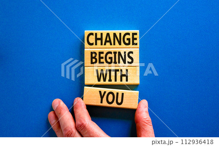 Change begins with you symbol. Concept words Change begins with you on wooden blocks on beautiful blue table blue background. Businessman hand. Business motivational change begins with you concept. Change begins with you symbol. Concept words Change begins with you on wooden blocks on beautiful blue table blue background. Businessman hand. Business motivational change begins with you concept. 112936418