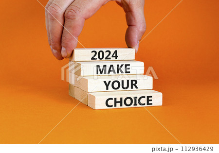 2024 Make your choice symbol. Concept words 2024 Make your choice on beautiful wooden block. Beautiful orange table orange background. Voter hand. Business 2024 Make your choice concept. Copy space. 2024 Make your choice symbol. Concept words 2024 Make your choice on beautiful wooden block. Beautiful orange table orange background. Voter hand. Business 2024 Make your choice concept. Copy space. 112936429