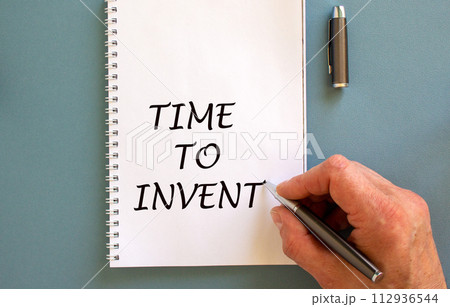 Hand writing 'time to invent' on white note, isolated on blue background. Hand writing 'time to invent' on white note, isolated on blue background. 112936544