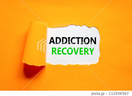 Addiction recovery symbol. Concept words Addiction recovery on beautiful white paper. Beautiful orange paper background. Psychology addiction recovery concept. Copy space. 112936567