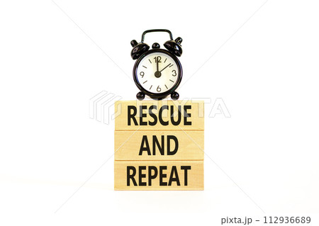 Rescue and repeat symbol. Concept words Rescue and repeat on wooden block on a beautiful white table white background. Black alarm clock. Business rescue and repeat concept. Copy space. 112936689