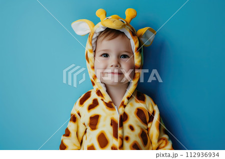 Cute boy in a giraffe costume on a blue background.	AI-generated item 112936934
