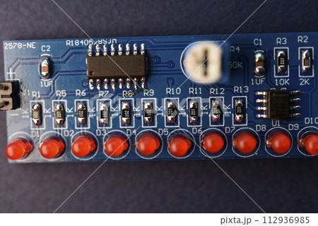 A printed circuit board with radio elements. LEDs and chips. A set for soldering an amateur radio. A printed circuit board with radio elements. LEDs and chips. A set for soldering an amateur radio. 112936985