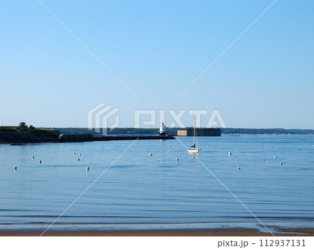 Beach with Portland Breakwater Lighthouse "Bug Light" at end of jetty rocky cove Beach with Portland Breakwater Lighthouse "Bug Light" at end of jetty rocky cove 112937131