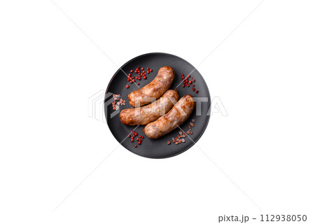 Grilled sausages with spices and herbs. With copy space Grilled sausages with spices and herbs. With copy space 112938050
