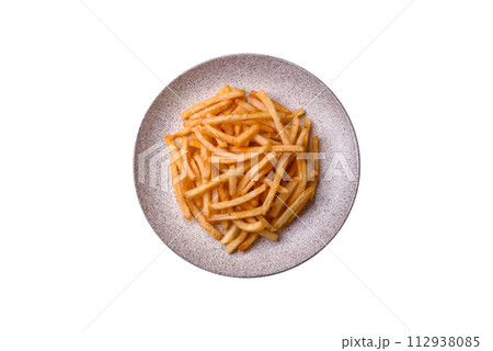 Delicious crispy golden fries with salt and spices 112938085