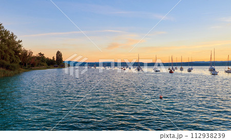 Bodensee Lake Sunrise Panorama. Morning Sunlight Over Tranquil Waters. 112938239