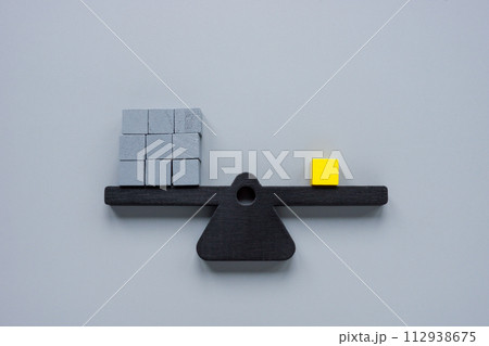 Scales with gray cubes and one yellow one. Be different, unique. Scales with gray cubes and one yellow one. Be different, unique. 112938675