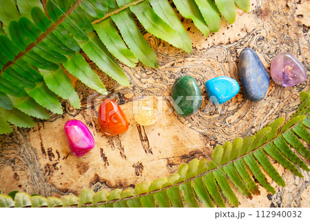 Healing crystals on brown background 112940032