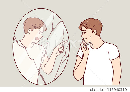 Man suffering from hallucinations and mental disorder looks in mirror with evil reflection 112940310