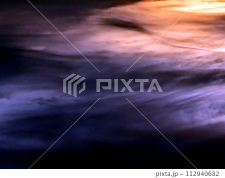 Dramatic Dark Forboading Sunset Clouds Abstract Blues and Yellows in the Sky Dramatic Dark Forboading Sunset Clouds Abstract Blues and Yellows in the Sky 112940682