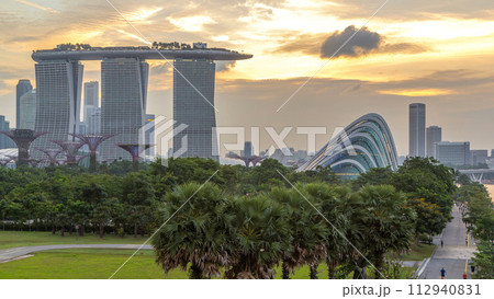 Marina Bay Sands, Gardens by the bay with cloud forest, flower dome and supertrees day to night timelapse after sunset 112940831