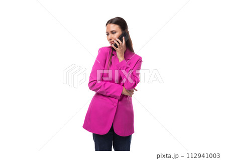 young slender office worker woman with black hair dressed in a lilac jacket communicates using a young slender office worker woman with black hair dressed in a lilac jacket communicates using a 112941003