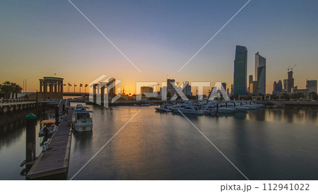 Sunrise. Yachts and boats at the Sharq Marina timelapse in Kuwait. Kuwait City, Middle East Sunrise. Yachts and boats at the Sharq Marina timelapse in Kuwait. Kuwait City, Middle East 112941022