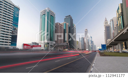 Skyscrapers at the Sheikh Zayed Road day to night in Dubai timelapse hyperlapse 112941177
