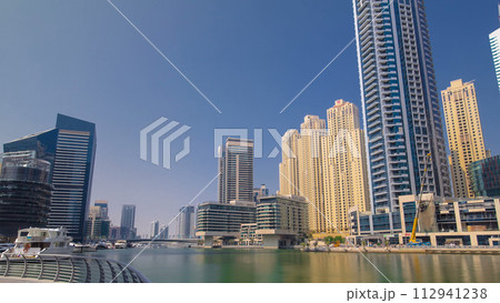 Dubai Marina skyscrapers. View from embankment timelapse hyperlapse Dubai Marina skyscrapers. View from embankment timelapse hyperlapse 112941238