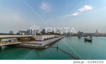 View of the Doha city in front of the Museum of Islamic Art day to night timelapse in the Qatari capital, Doha. View of the Doha city in front of the Museum of Islamic Art day to night timelapse in the Qatari capital, Doha. 112941318