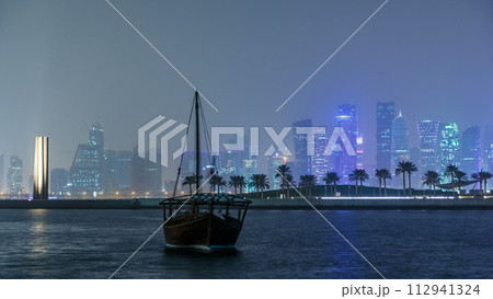 A panoramic view of the old dhow harbour night timelapse in Doha, Qatar, with A panoramic view of the old dhow harbour night timelapse in Doha, Qatar, with 112941324