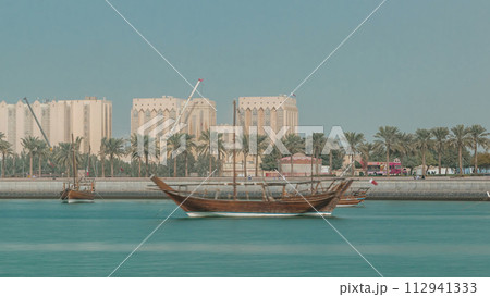 Dhows moored off Museum Park timelapse in central Doha 112941333