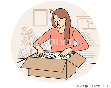 Smiling woman unpack box with order 112941393