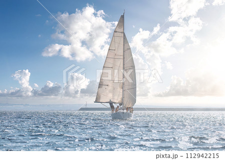 Serene sailing adventure on sparkling sea Serene sailing adventure on sparkling sea 112942215