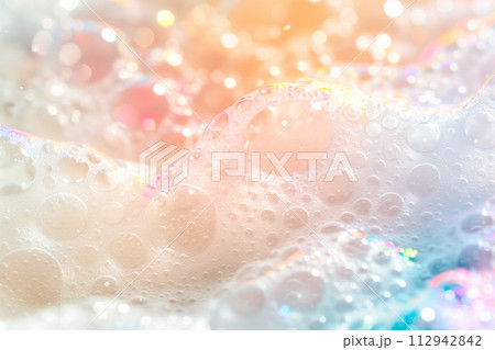 Close up of soapy foam texture as a background. Macro shot of bubbles with shimmering effect on the surface Close up of soapy foam texture as a background. Macro shot of bubbles with shimmering effect on the surface 112942842