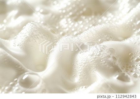 Close up of soapy foam texture as a background. Macro shot of bubbles with shimmering effect on the surface Close up of soapy foam texture as a background. Macro shot of bubbles with shimmering effect on the surface 112942843