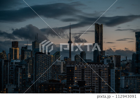 sunset over Toronto city downtown skyline, sunrise over CN Tower and skyscrapers of financial district Canada 112943091