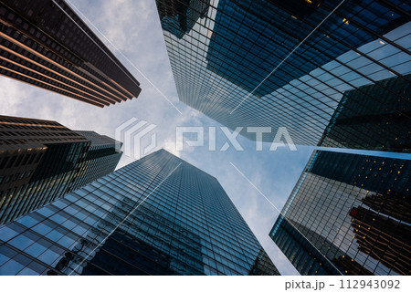 tall skyscrapers buildings looking up perspective, modern architecture of steel and glass, skyline of big city 112943092