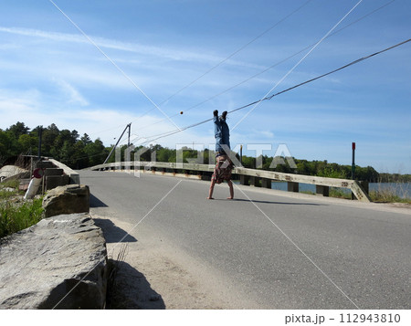 Man Handstands Talbot Rd. Bridge, Cousins to Littlejohn Island, Yarmouth, Maine 112943810