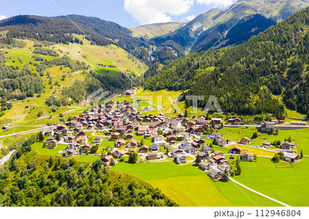 View from a height of the Curaglia village in the valley medel View from a height of the Curaglia village in the valley medel 112946804