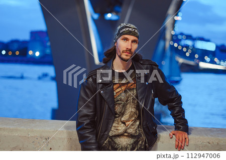 The guy in the leather jacket and bandana 112947006