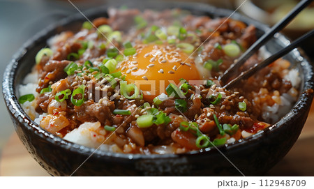AI-generated content. A close up of a dish of food with chopsticks showcasing a mix of fresh vegetables, meat, and fines herbes, on a tableware 112948709