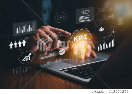 Man analyzes business finance data on laptop, investment figures digital marketing KPI and sales report. Utilizing financial management technology, an advisor navigates KPI virtual screen cyber space. 112951245