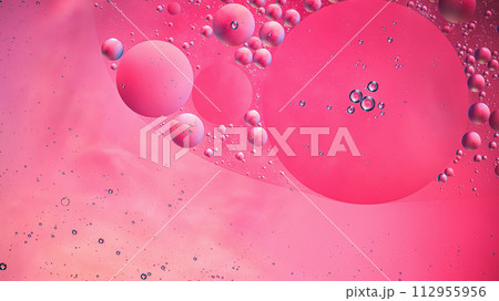 Abstract pink colorful background with oil on water surface. Oil drops in water abstract psychedelic, abstract image. Abstract pink colorful background with oil on water surface. Oil drops in water abstract psychedelic, abstract image. 112955956
