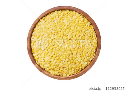 bowl of dry yellow lentils isolated on white background 112958025