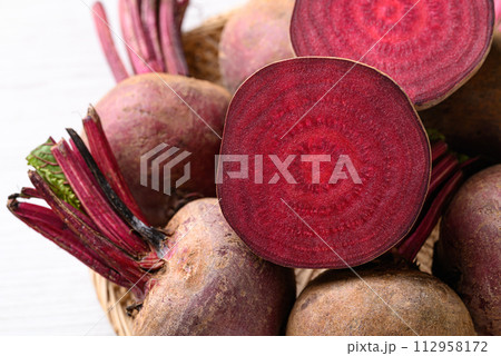 Fresh beetroot in natural basket, Food ingredient 112958172