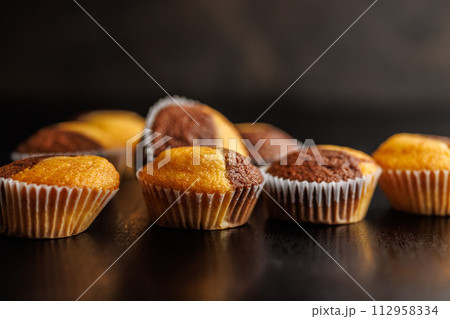 Close Up of a Muffins on black table. Close Up of a Muffins on black table. 112958334