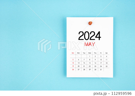 May 2024 calendar page with push pin on blue background. May 2024 calendar page with push pin on blue background. 112959596
