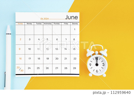 June 2024 Monthly calendar for 2024 year with pen on yellow and blue background. June 2024 Monthly calendar for 2024 year with pen on yellow and blue background. 112959640